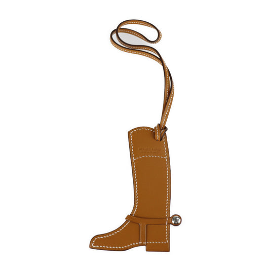 超美品 HERMES エルメス パドック ボット ブーツ その他小物 - スイフト バトラー ナチュラルサブレ ピンク系 ストラップ バッグチャーム 拍車付きジョッキーブーツ