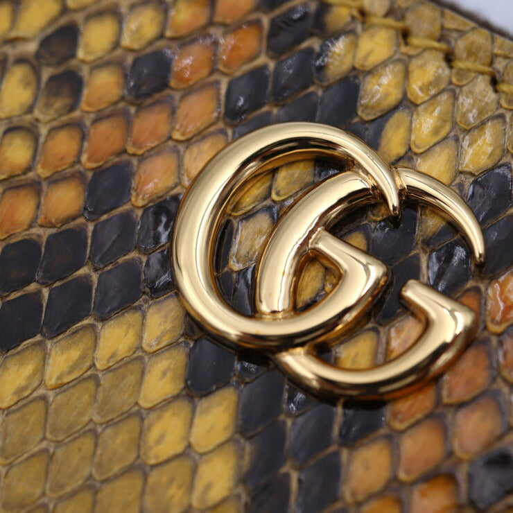 GUCCI GG Marmont Long Wallet 456117 in good condition, made of python, brown and yellow, gold hardware, round zipper, and exotic leather