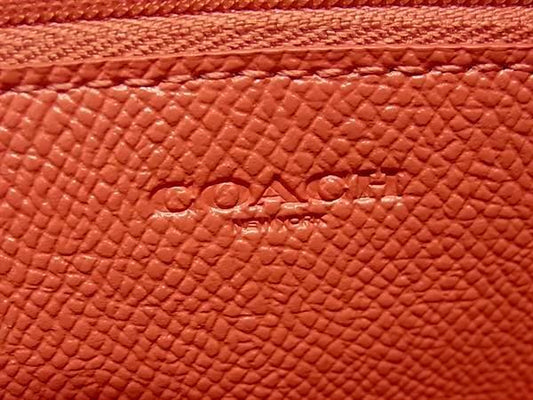 COACH コーチ 長財布 ボーダー スタッズ アコーディオン ジップ アラウンド F55610 コーラルピンク系 レザー レディース スタッズ シルバー金具 新古未使用展示品