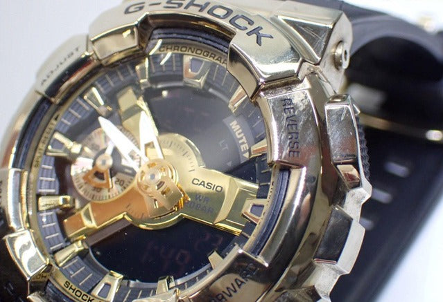 CASIO カシオ 腕時計 G SHOCK ジーショック Metal Covered 110シリーズ GM-110G-1A9JF ゴールド ブラック系 SS × 樹脂 メンズ アナデジ 美品